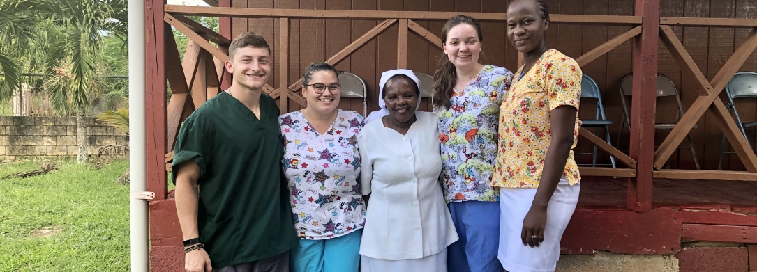 Students on an Immersion Trip with women from the community.