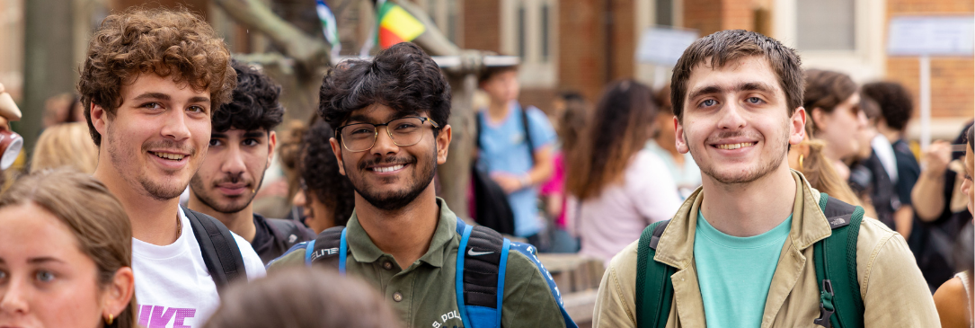 male students at outdoor community gathering